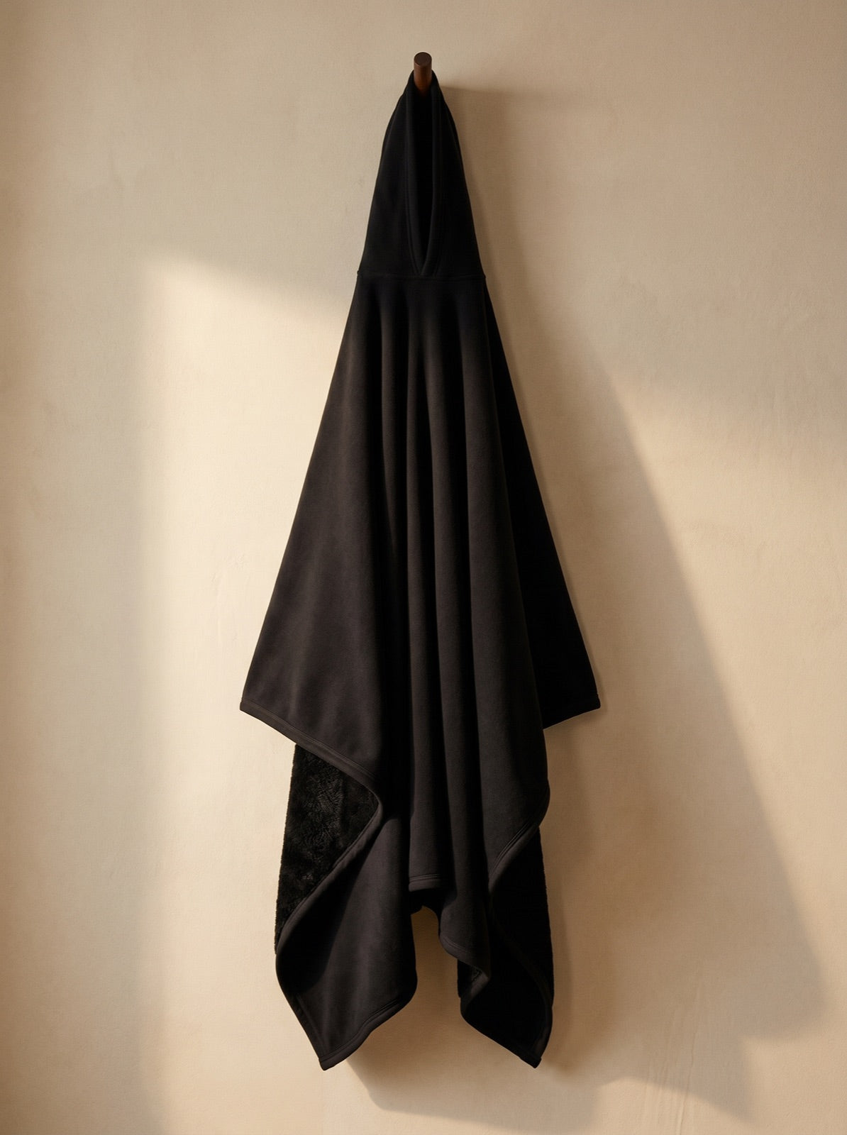 Enfold in Obsidian, corner folded to show the faux fur interior