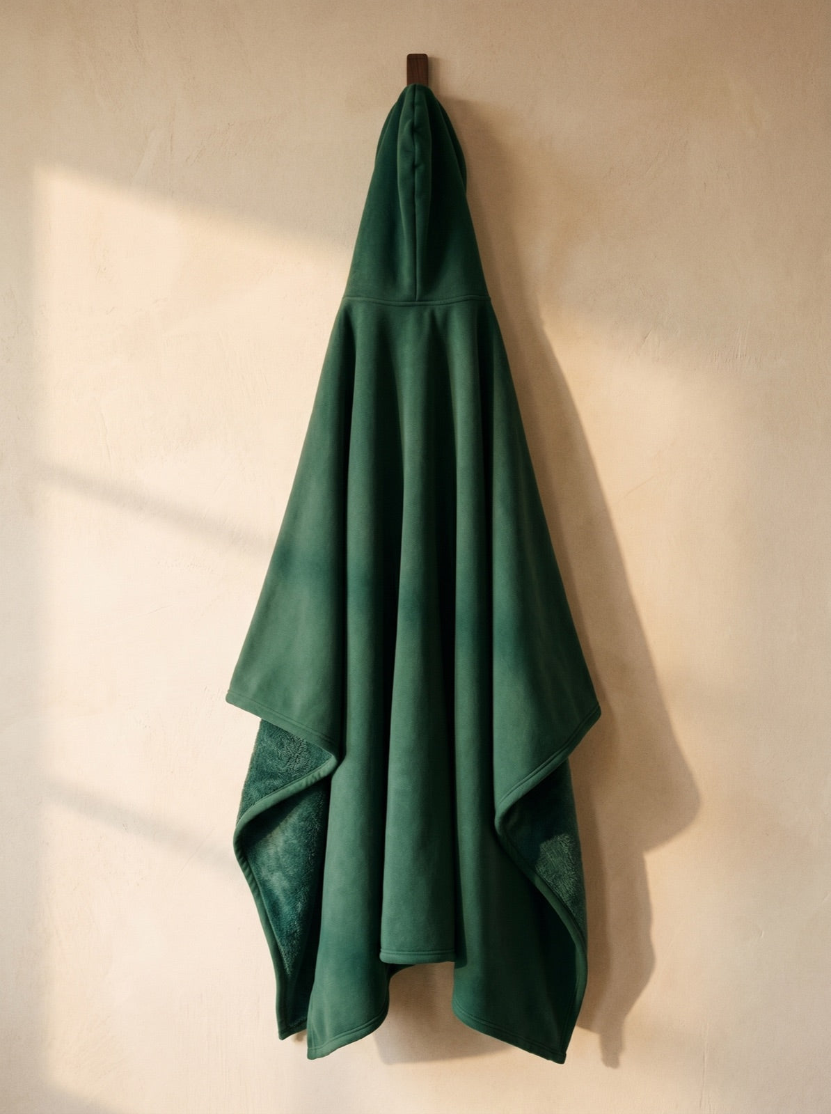Enfold in Willow, corner folded to show the faux fur interior