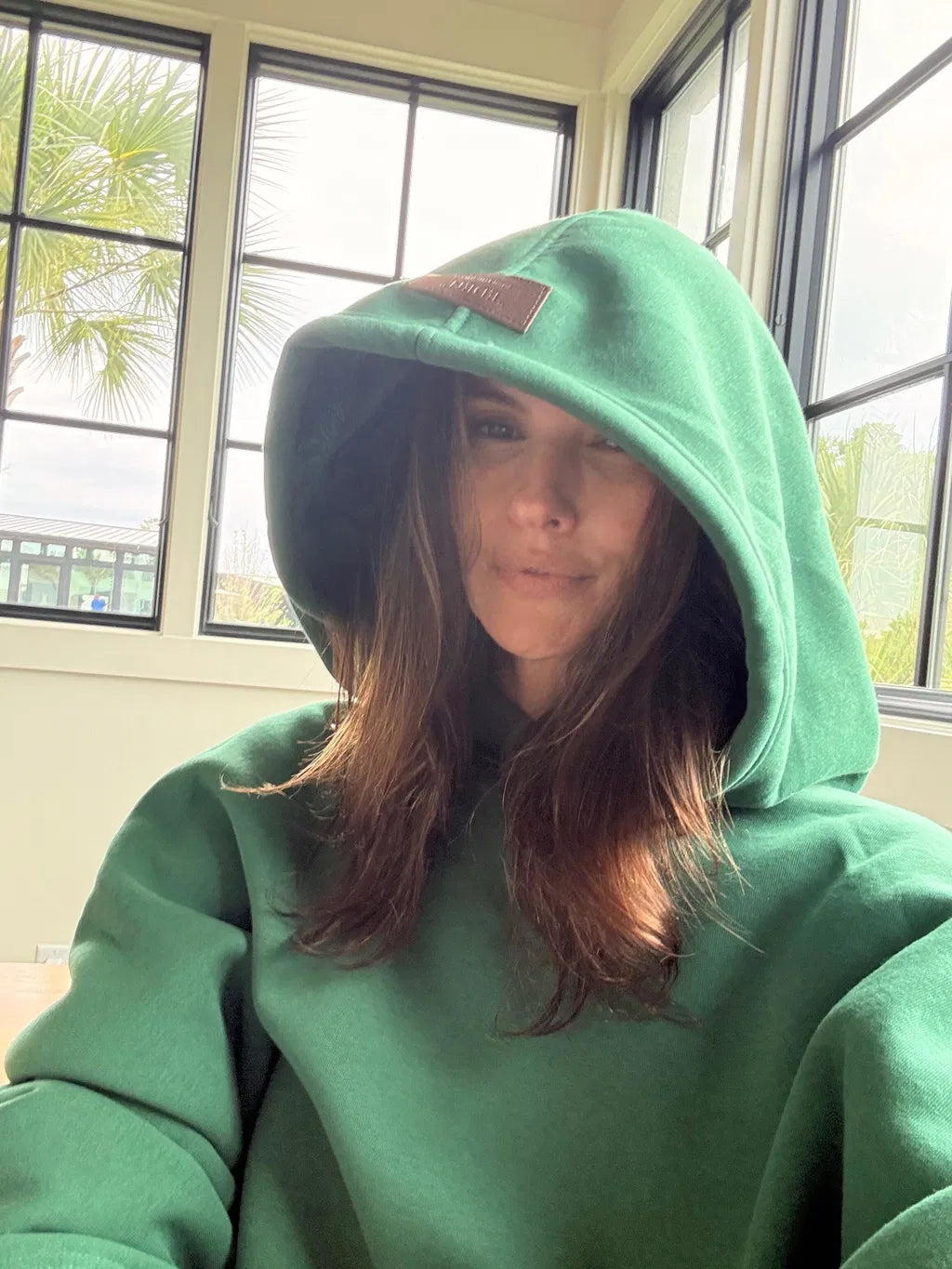 A Solenne customer wearing Enfold at home